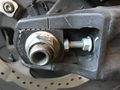 Rear Axle Nut and right adjustment bolt - loosened.jpeg